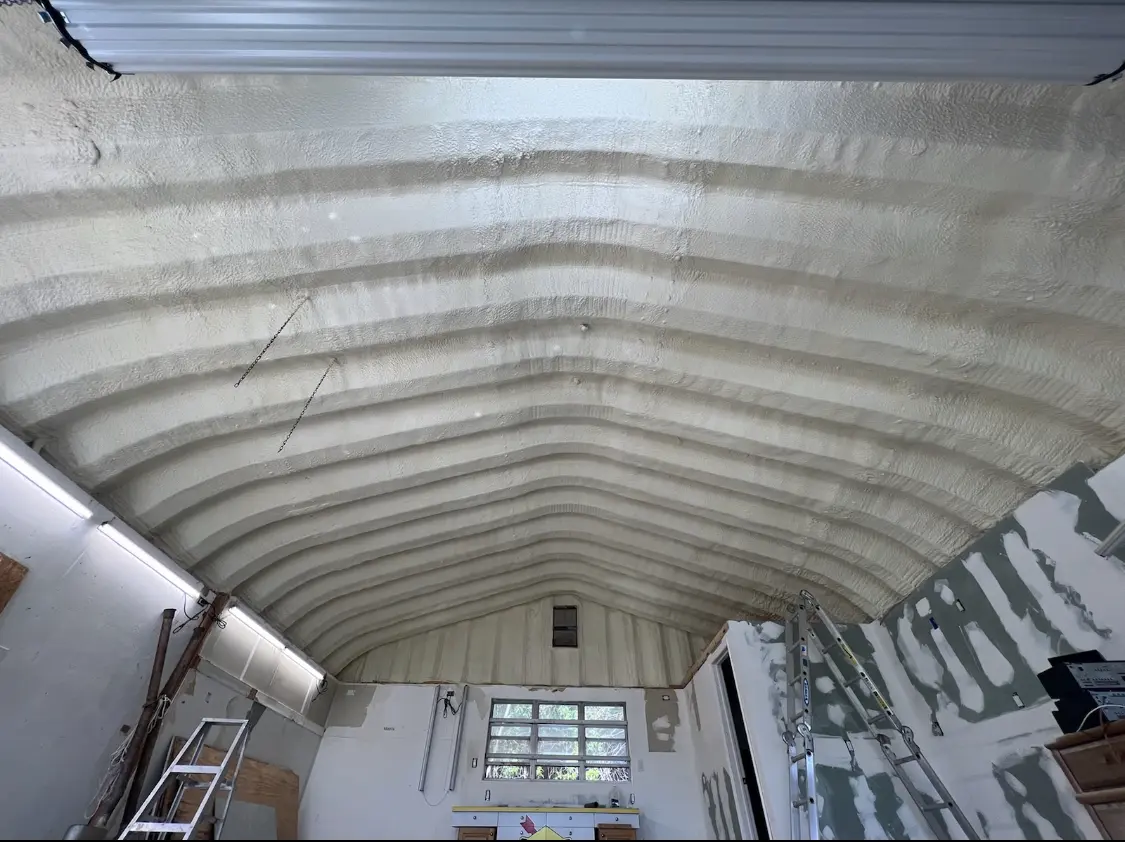 Spray polyurethane foam applied to the underside of a metal roof deck in Fussels Corner